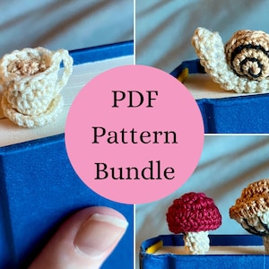 May include: A collection of small crocheted items including a cream-colored teacup and saucer, a beige snail with black spiral details, a red mushroom, and a tan mushroom, all displayed on the top edge of a blue book with text PDF Pattern Bundle.