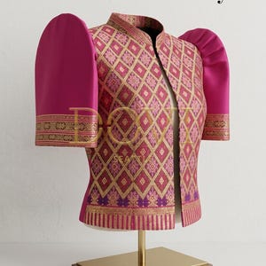 May include: A magenta and gold patterned jacket with puffed sleeves, displayed on a gold stand. The jacket features a diamond pattern with gold accents and decorative trim. The text "Style 10" is visible in the upper right corner.