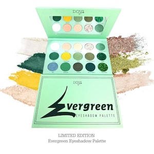 May include: A green and white eyeshadow palette with the words "Dovi Girls Evergreen Eyeshadow Palette" on the front. The palette has 18 shades, including greens, browns, and golds.