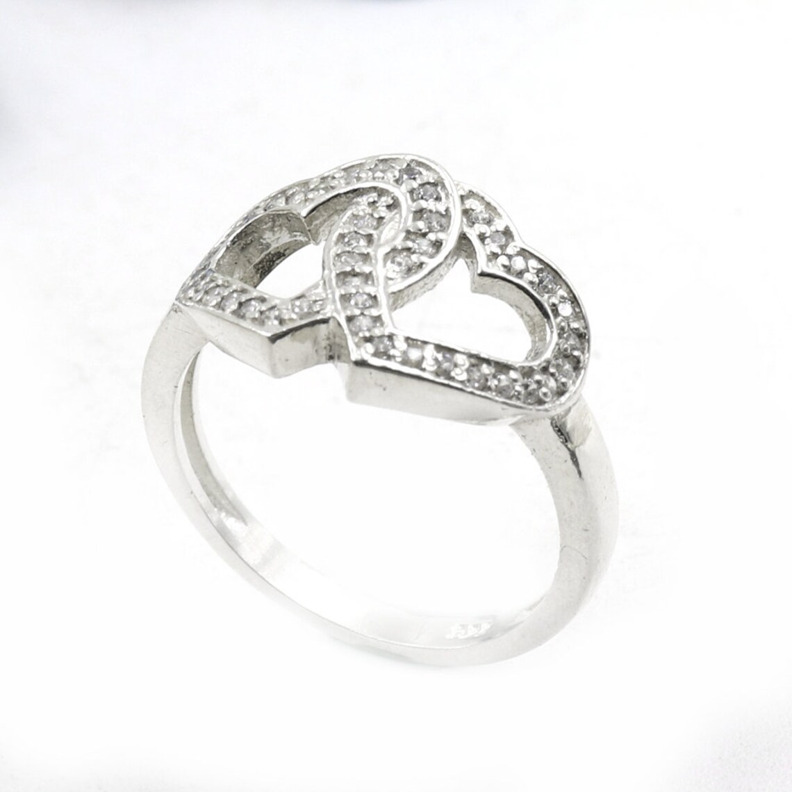 Buy 2hearts Ring Consisting of White Zircons Made in 925 Sterling