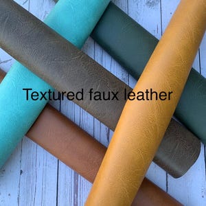 May include: Assortment of rolled textured faux leather in various colors, including teal, olive green, brown, and mustard yellow. The image includes the text "Textured faux leather".