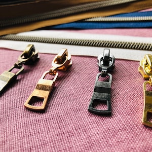 Size 5 zipper pulls for nylon zipper tapes, zipper slides A3bl