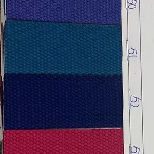 May include: A close-up of 10 fabric swatches with different colors and textures. The swatches are labeled with numbers 46 through 55.