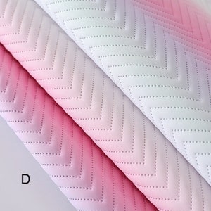 May include: Three pieces of fabric with a chevron pattern and a gradient color effect. The fabric is pink, light pink, and white. The fabric has a textured surface.