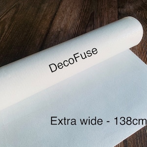 May include: A white roll of DecoFuse fabric, labeled "DecoFuse" and "Extra wide - 138cm".