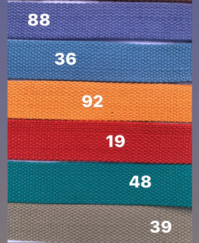 May include: Six different colored fabric straps with numbers printed on them. The numbers are 88, 36, 92, 19, 48, and 39.