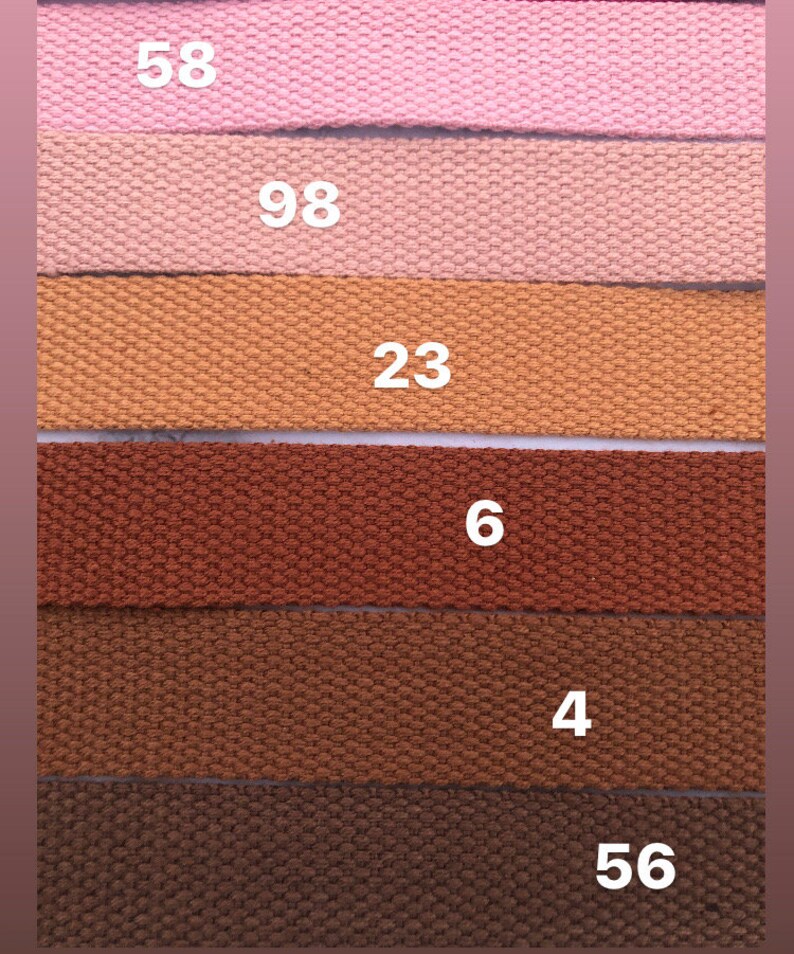 May include: Six different colored fabric straps with numbers printed on them. The numbers are 58, 98, 23, 6, 4, and 56.