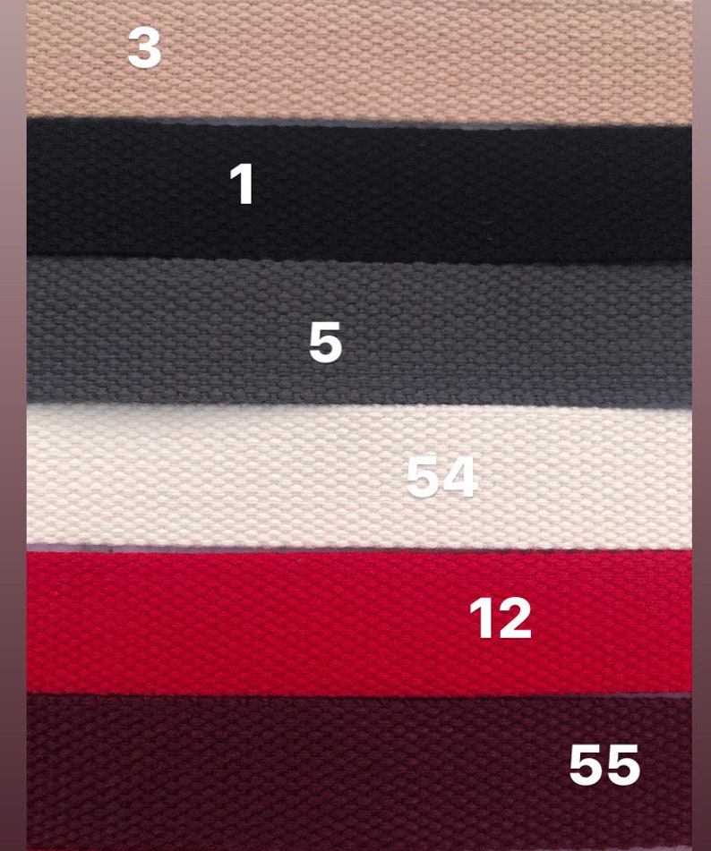 May include: Six different colors of woven fabric strips with numbers 3, 1, 5, 54, 12, and 55 printed on them.