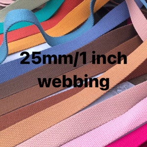 May include: A variety of colors of 25mm/1 inch wide cotton webbing. The webbing is woven and has a textured surface.