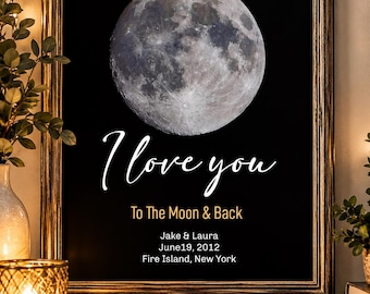 May include: A framed wall art print featuring a detailed image of the full moon against a black background. The text reads: I love you, To The Moon & Back, Jake & Laura, June 19, 2012, Fire Island, New York. The frame is dark wood with gold accents.