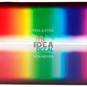 May include: A rectangular peel and stick decal featuring a vibrant horizontal rainbow gradient transitioning from red to orange, yellow, green, blue, and purple. The text Art IDEA DECAL is centered with the words PEEL & STICK and NON-WOVEN.