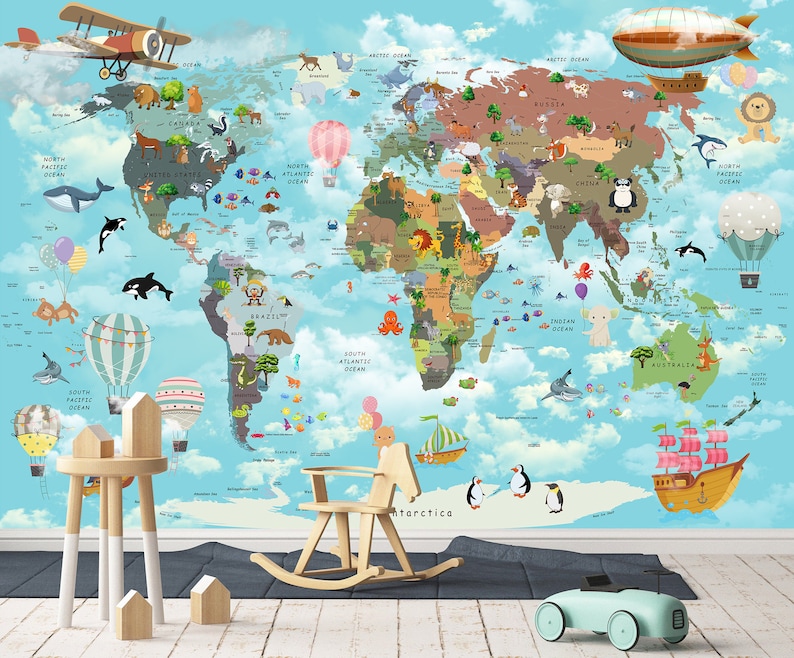 May include: A colorful world map with cartoon animals and illustrations of airplanes, hot air balloons, and ships. The map is on a blue background with white clouds. There are also some wooden toys in the foreground, including a rocking horse and a toy car.