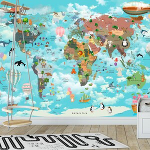 May include: A colorful world map with animals and illustrations on a blue background. The map is on a wall with a wooden swing hanging in front of it. There is a white crib with a pink and white pillow in the corner of the room.