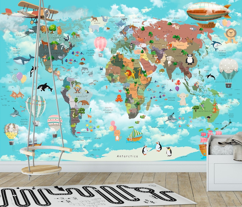 May include: A colorful world map with animals and illustrations on a blue background. The map is on a wall with a wooden swing hanging in front of it. There is a white crib with a pink and white pillow in the corner of the room.