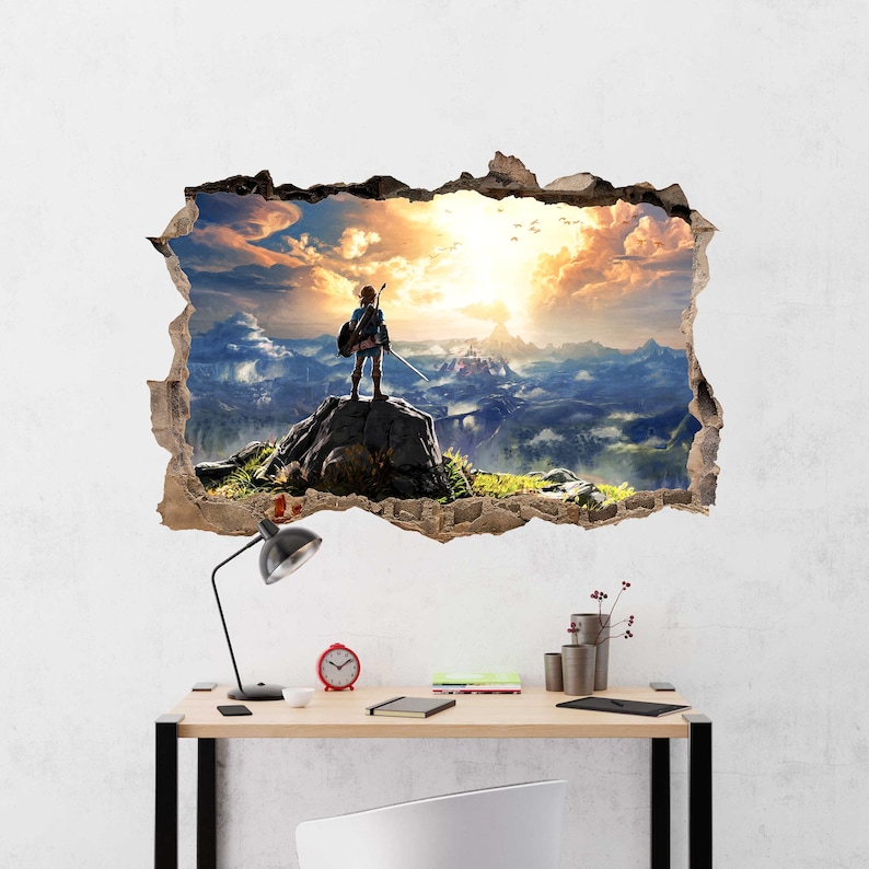 Puede incluir: Un adhesivo de pared con efecto 3D que muestra un agujero en la pared revelando un paisaje. Una figura se encuentra sobre un pico rocoso con vistas a un valle con monta&ntilde;as, un puente y un cielo al atardecer. Los bordes parecen estar rasgados.