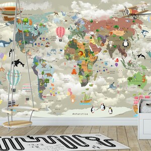 May include: A wall mural featuring a world map with colorful illustrations of animals, hot air balloons, and airplanes set against a cloudy sky background. The map includes labeled continents and oceans with various creatures placed across the globe.