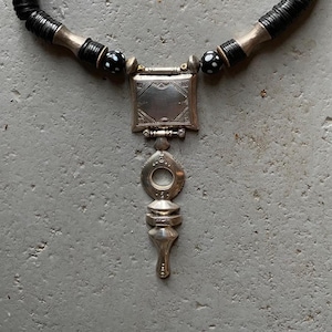 A Tuareg collier, heavy big silver Tuareg cross of Zinder (Niger)with coco noir and silver beads and a silver clasp