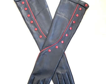 May include: A pair of long black leather gloves with a red trim and red button accents.