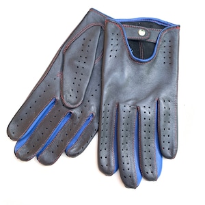 May include: A pair of black leather driving gloves with blue trim and red stitching. The gloves have a perforated design and a button closure.