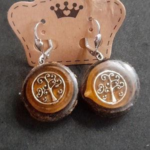 Unique earring tree disc from the local golden rain with tree of life cast in epoxy