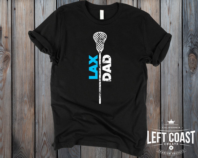 May include: Black t-shirt with a white lacrosse stick and the words "LAX DAD" printed vertically on the stick.