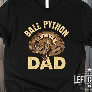 May include: Black t-shirt with a graphic of a ball python snake and the text "Ball Python Dad".