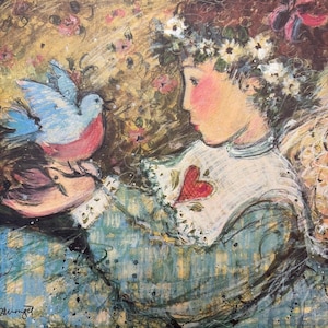 May include: A canvas painting depicting a profile view of a figure with a floral crown, wearing a blue garment with a white collar featuring a red heart. The figure holds a light blue bird with a pink chest. The background has a floral pattern.