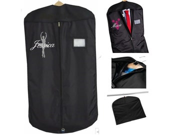 May include: Black garment bag with a zipper closure and a clear plastic window. The bag has a white embroidered ballerina silhouette and the name "Jessica".
