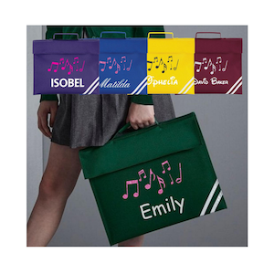 May include: School satchels in purple, blue, yellow, and green, each with a name and musical notes design. White stripes are on the lower right corner of each bag. The bags have a handle and a flap closure.