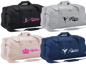 May include: Four different color duffel bags with personalized embroidery. The bags are black, gray, pink, and blue. The embroidery includes a ballerina, a crown, and the names Bethany, Keira, Ava-Rose, and Lily-mae.