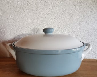 May include: A light blue ceramic casserole dish with a white lid and two white handles.