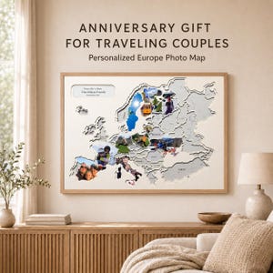 May include: A rectangular wall map of Europe featuring a light-coloured wooden frame and a white background. The map displays cut-out country shapes filled with various personal photographs. Text at the top reads ANNIVERSARY GIFT FOR TRAVELING COUPLES.