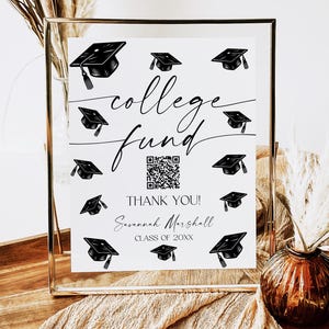 May include: A white sign with black graduation caps and the text "college fund" in black cursive. A QR code is in the center of the sign. The text "Thank You! Savannah Marshall Class of 20XX" is below the QR code.