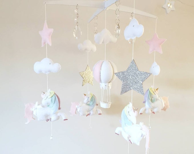 pink and grey cot mobile