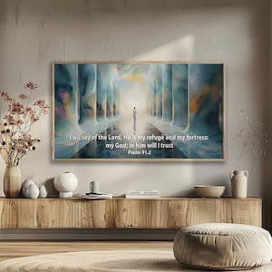 May include: A rectangular wall art print featuring an abstract corridor of blue and gold pillars with a lone figure walking toward a bright light. The text reads: I will say of the Lord, He is my refuge and my fortress: my God; In him will I trust Psalm 91.2.