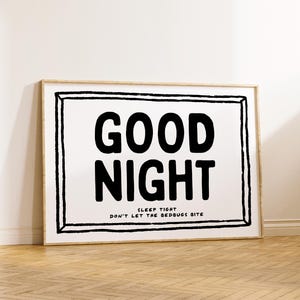 May include: Black and white framed print with the text "GOOD NIGHT" and the smaller text "SLEEP TIGHT DON'T LET THE BEDBUGS BITE".