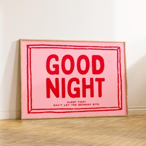 May include: A framed pink and red print with the text "GOOD NIGHT" and the smaller text "SLEEP TIGHT DON'T LET THE BEDBUGS BITE".