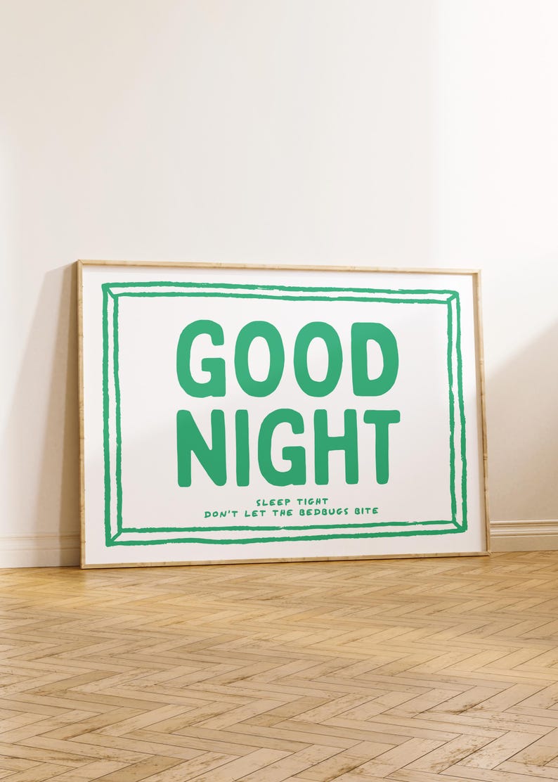 May include: A framed print with a white background and a green border. The text "GOOD NIGHT" is written in large green letters. Below the text is the phrase "SLEEP TIGHT DON'T LET THE BEDBUGS BITE".