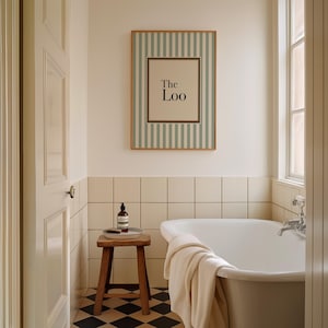 May include: A bathroom scene featuring a framed sign that reads "The Loo" with a striped background. The room includes a white bathtub, a wooden stool, and a window. The floor has a black and white checkered pattern.