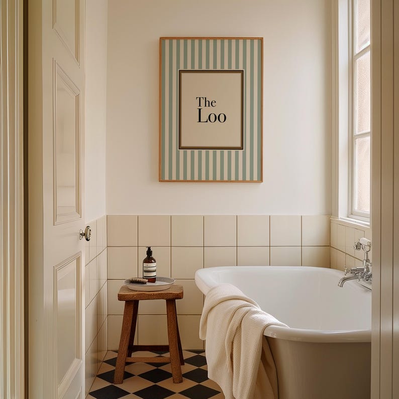 May include: A bathroom scene featuring a framed sign that reads "The Loo" with a striped background. The room includes a white bathtub, a wooden stool, and a window. The floor has a black and white checkered pattern.