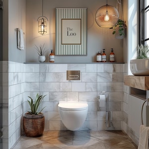 May include: A modern bathroom with a white wall-mounted toilet, a framed sign that says "The Loo", and decorative plants. The walls are tiled with marble-like tiles. The room is lit by pendant lights and a large globe light.