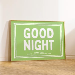 May include: A framed green poster with white text that reads "GOOD NIGHT SLEEP TIGHT DON'T LET THE BEDBUGS BITE".