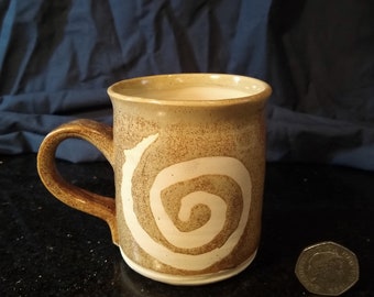 Hand thrown stoneware mug with spiral pattern, original ceramic mug from studio pottery, traditional hand made ceramics by ProperPotteryGB.