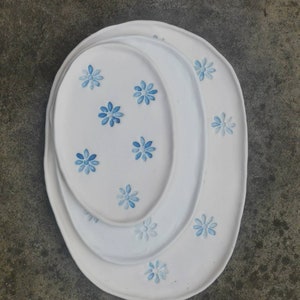 Handmade porcelain plate nest with stamped blue flowers
