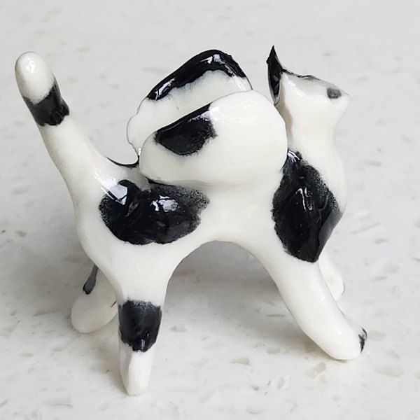 Winged black and white cat figure, angel cat, handmade porcelain animal