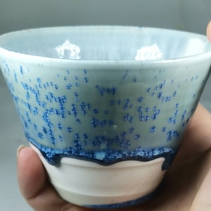 Handmade porcelain cup with blue crystal glaze