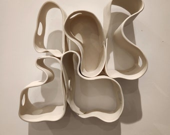 Abstract porcelain wall sculpture.