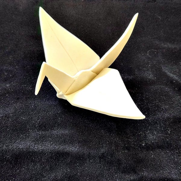 Porcelain Origami Crane sculpture. Handmade ceramic ornament.