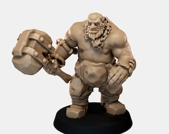 May include: A beige unpainted miniature figurine of a muscular humanoid warrior standing on a black circular base. The figure features a prominent beard, a chain necklace, and holds a large, heavy hammer in the right hand.