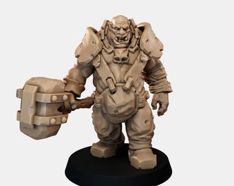 May include: A beige unpainted miniature figurine of a muscular humanoid creature with tusks, wearing heavy shoulder armor and a skull-adorned chest harness, holding a large rectangular hammer, standing on a circular black base.
